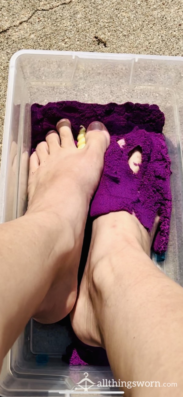 Long Toes Playing In Purple Kinetic Sand With A Toy