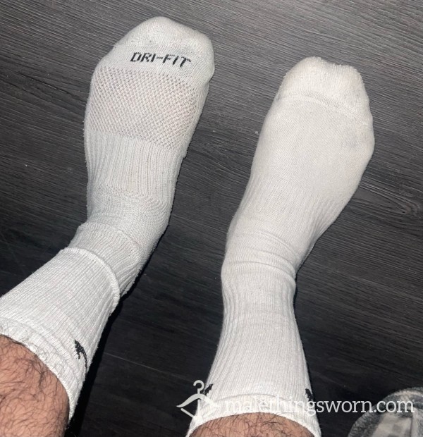 Musky Mismatched White Nike Long Socks. photo