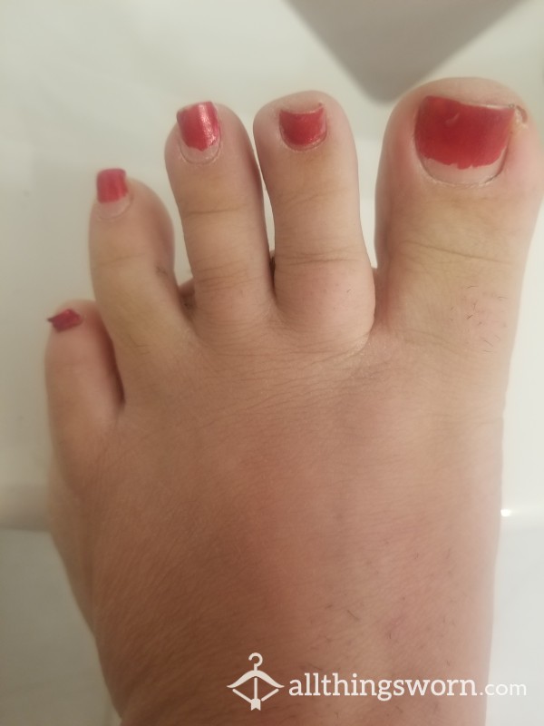 Too Long Painted Toe Nails Close Up Of Soles, Spitting On Feet And Rubbing It In