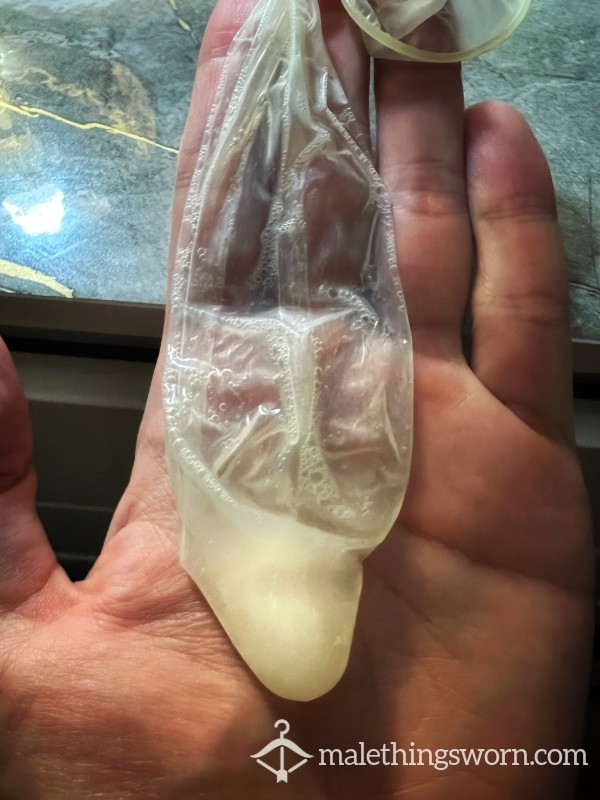 Used Condom Filled With Thick Cum