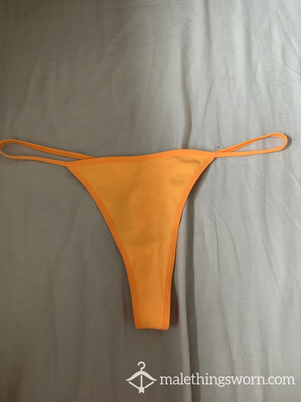 Well-worn Orange G-string