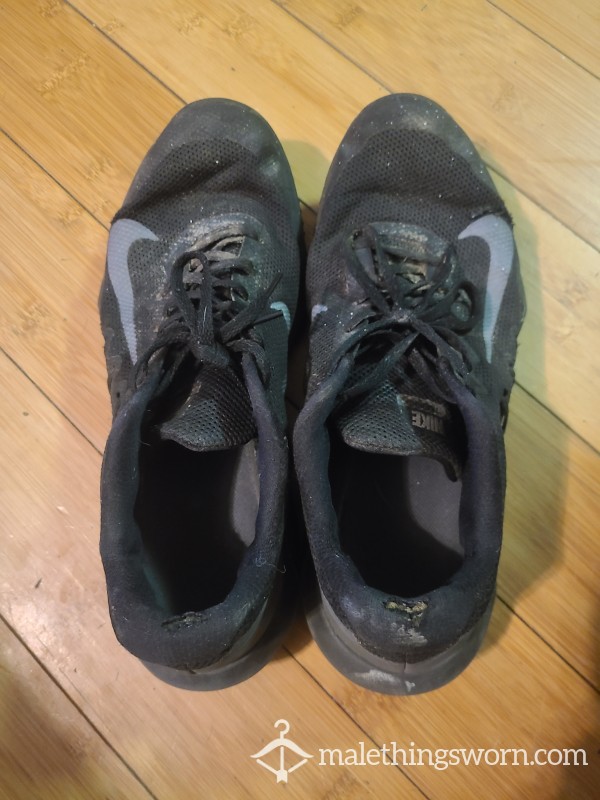 Well-worn Used And Abused Mens Sneakers photo